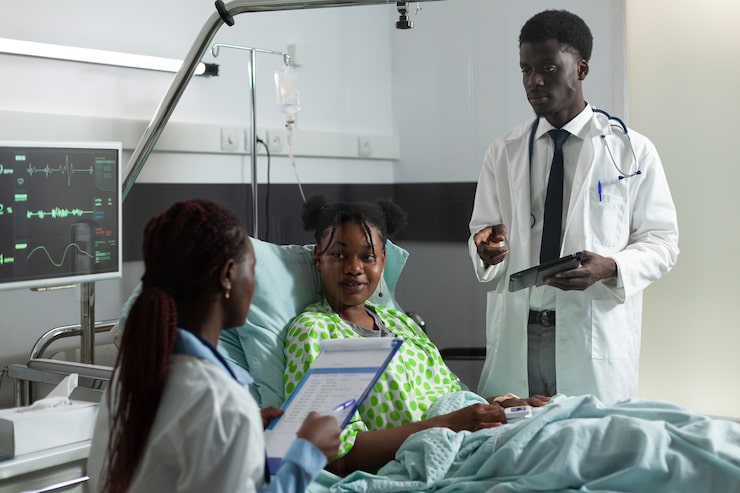 african american man woman talking girl hospital ward about healing treatment diagnosis doctors examining sick young patient with cervical neck collar sitting bed_482257 16515